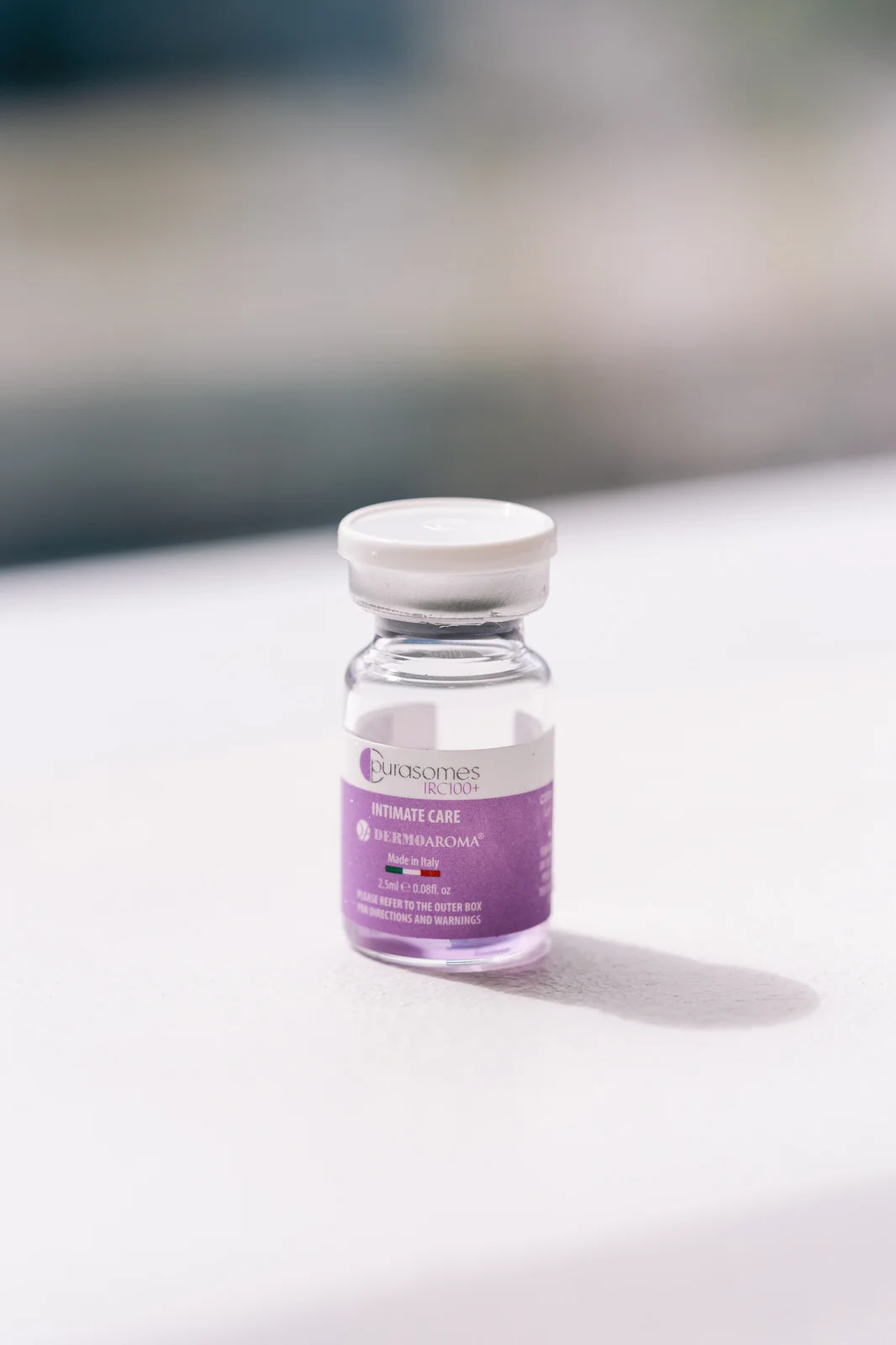 CDM Medical — Purasomes ampolla violeta fondo blanco